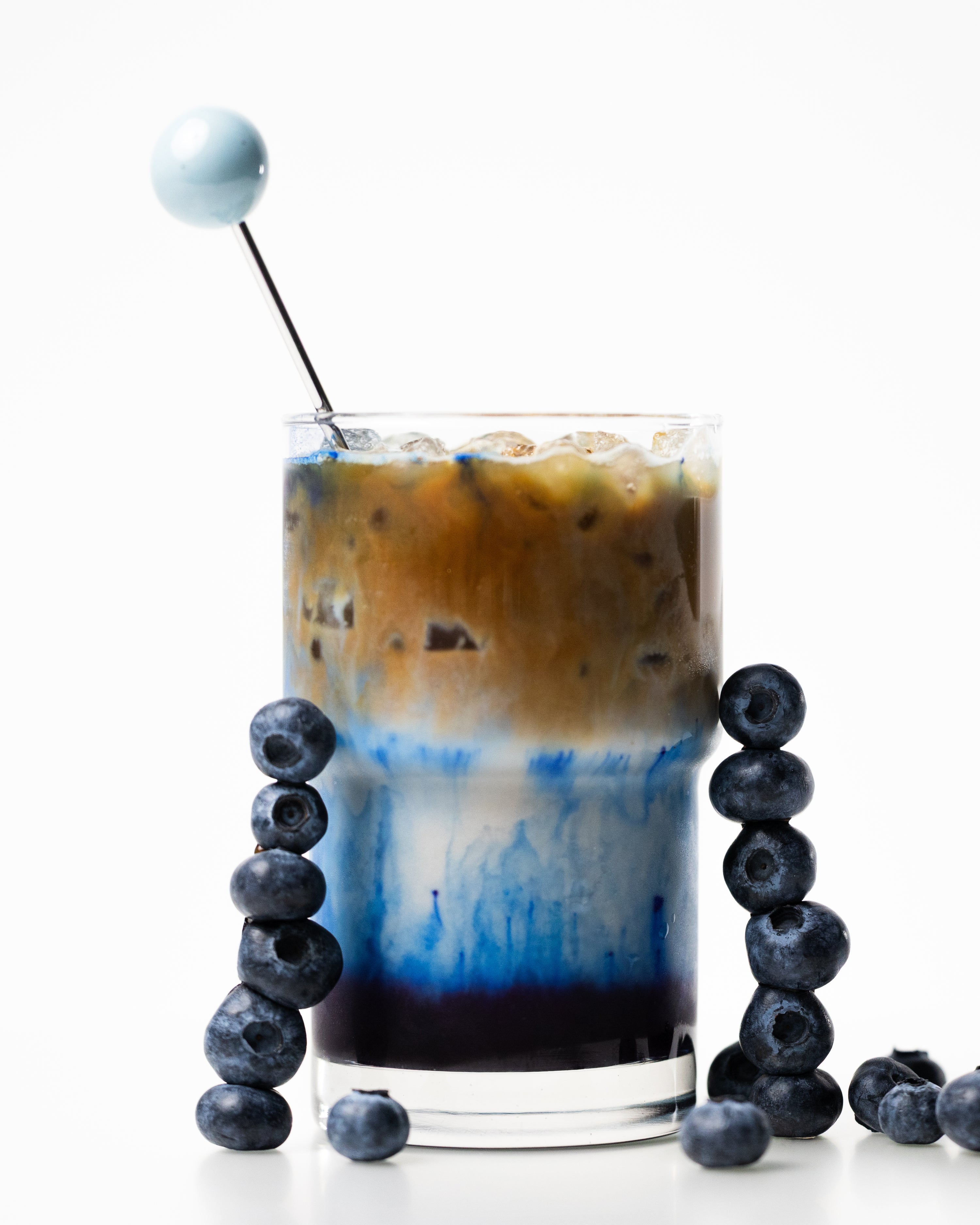 Blueberry syrup + blue spirulina + original oat milk + espresso poured slowly on top 